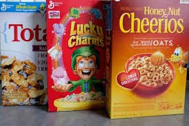 Three boxes of General Mills cereal: Total, Lucky Charms and Honey Nut Cheerios.